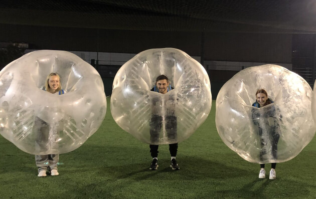 3 members at Enhance Media having fun